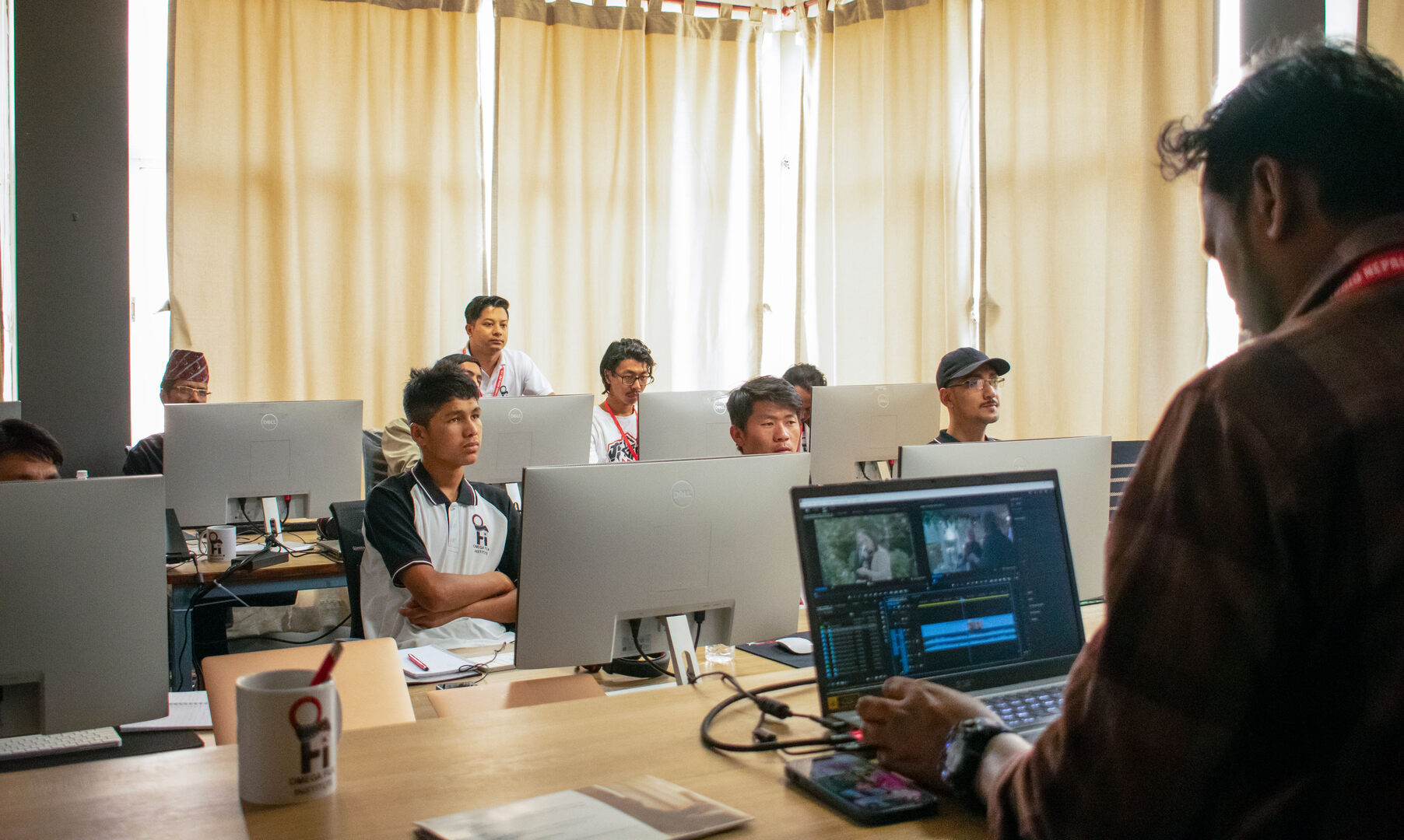 Students learning video editing at Omega Film School Nepal