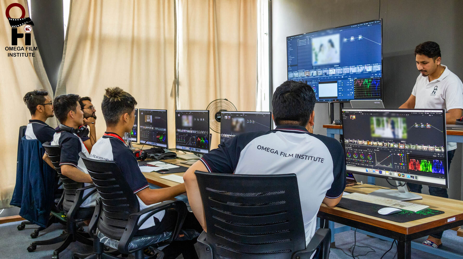 Students learning video editing at Omega Film School Nepal