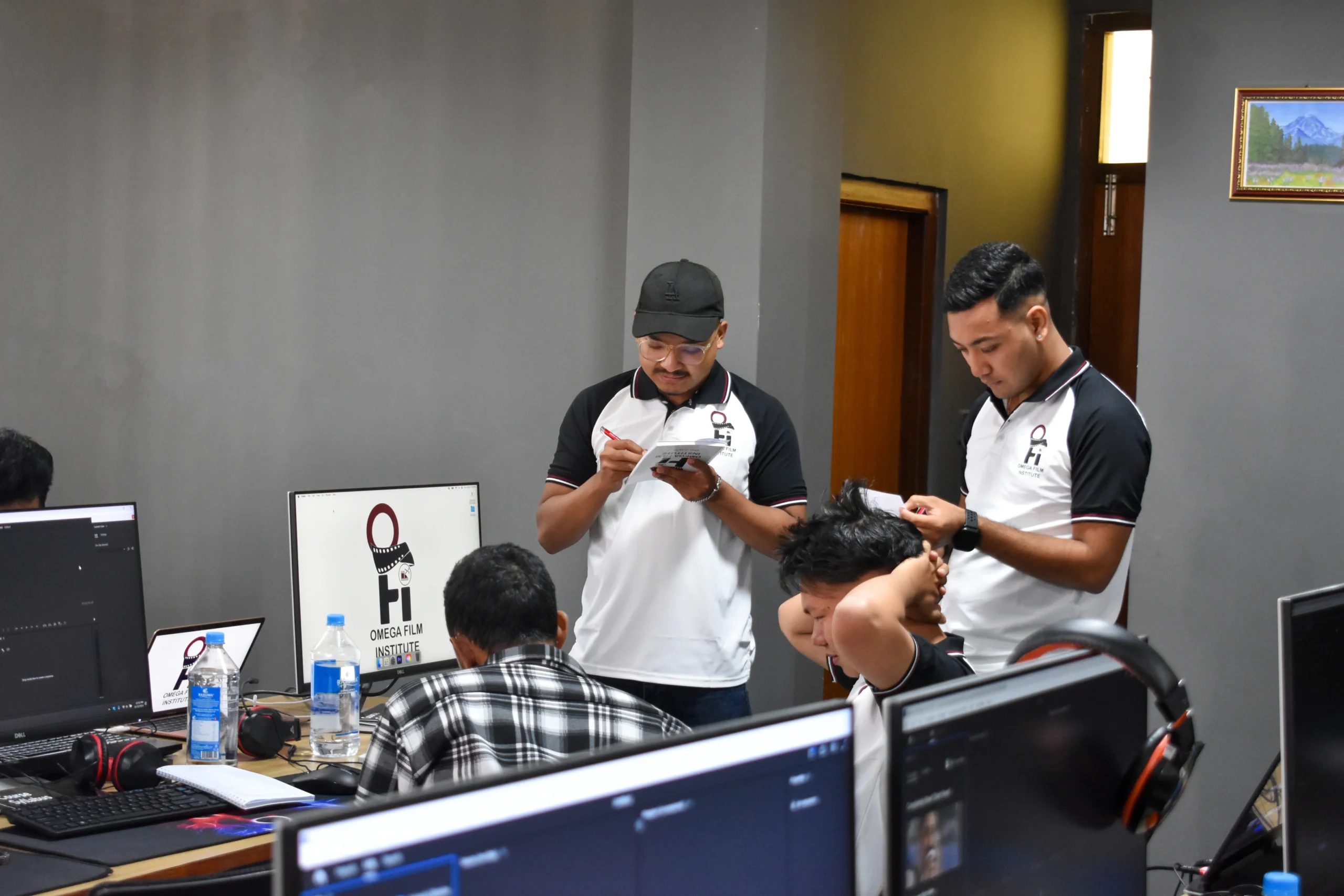 New students experimenting with light setups in a filmmaking workshop at Omega Film Institute Nepal.